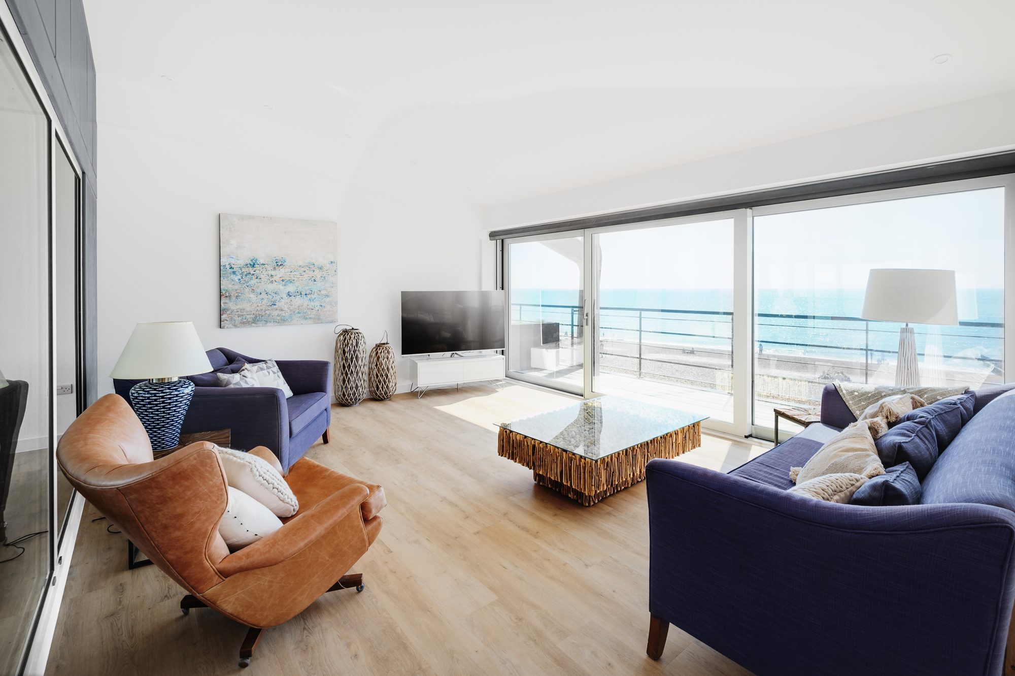 The living room at Alexanders, with sofas facing the sea